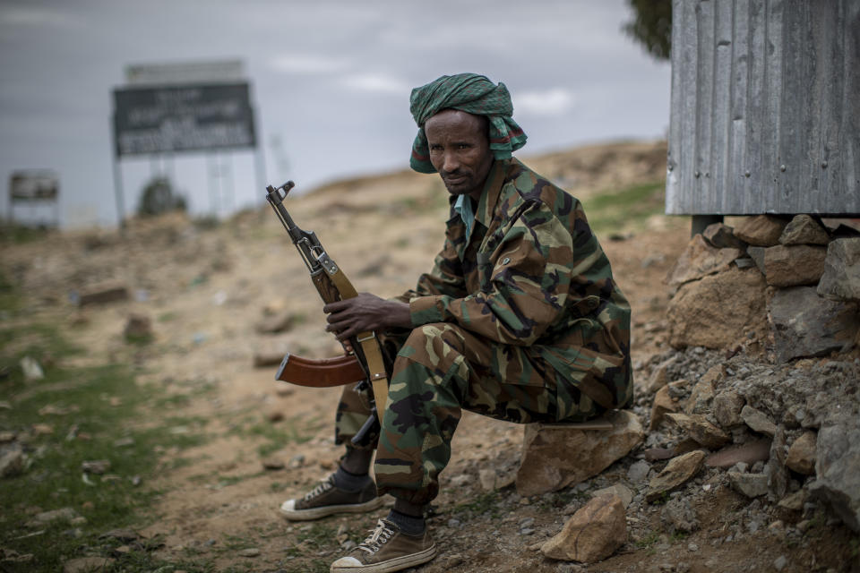 A fighter loyal to the Tigray People's Liberation Front (TPLF) mans a guard post on the outskirts of the town of Hawzen, then-controlled by the group, in the Tigray region of northern Ethiopia. (Ben Curtis/AP)