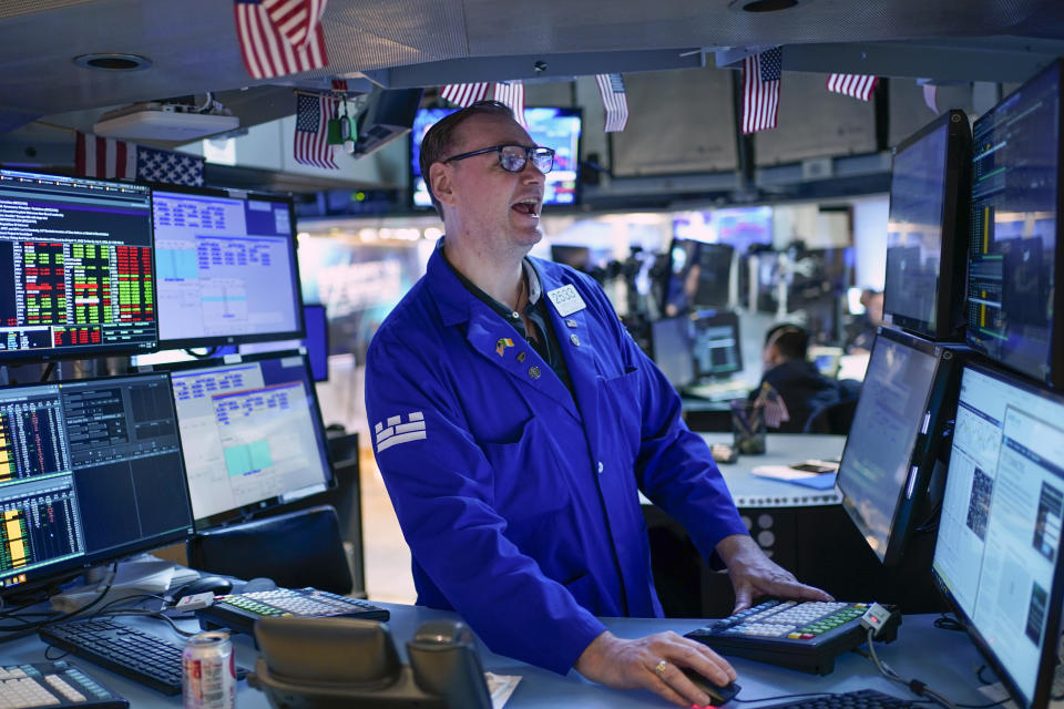 FILE - Traders work on the floor at the New York Stock Exchange in New York, July 1, 2022. A new poll from The Associated Press-NORC Center for Public Affairs Research shows an upheaval in priorities just months before critical midterm elections. (AP Photo/Seth Wenig, File)