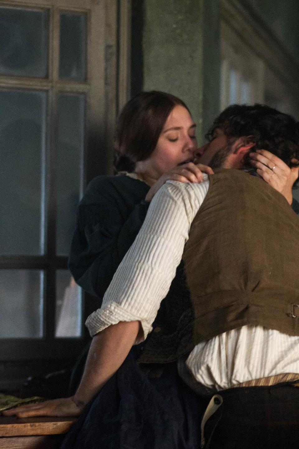 This photo released by Roadside Attractions shows Elizabeth Olsen, left, as Therese Raquin and Oscar Isaac, as Laurent LeClaire, in director and screenwriter, Charlie Stratton's film, "In Secret." The story is based on Emile Zola's novel, "Therese Raquin." (AP Photo/Roadside Attractions, Phil Bray)