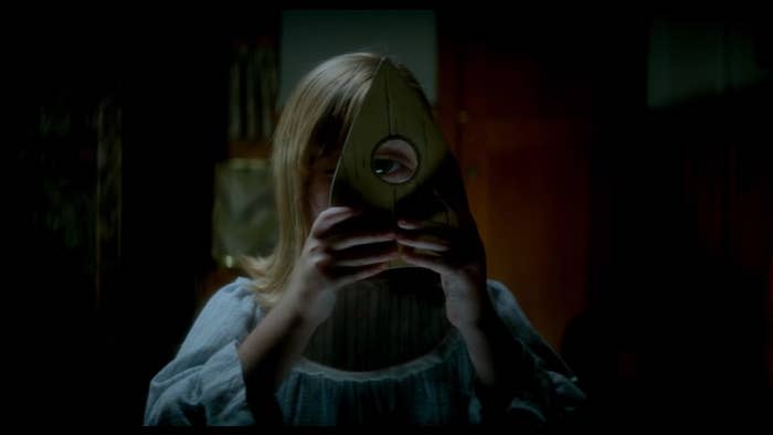 Doris looking through a planchet lens in "Ouija: Origin of Evil"