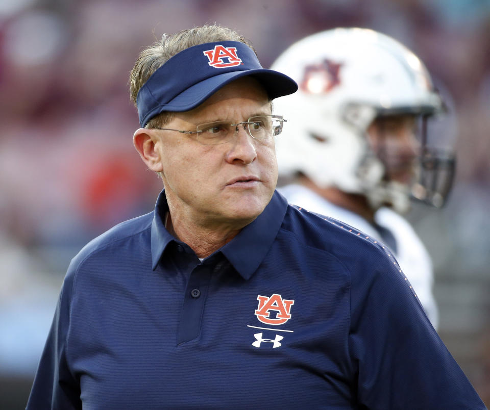 Auburn coach Gus Malzahn, watching players warm up before facing Mississippi State this month, is 5-3 overall and 2-3 in the SEC. (AP)