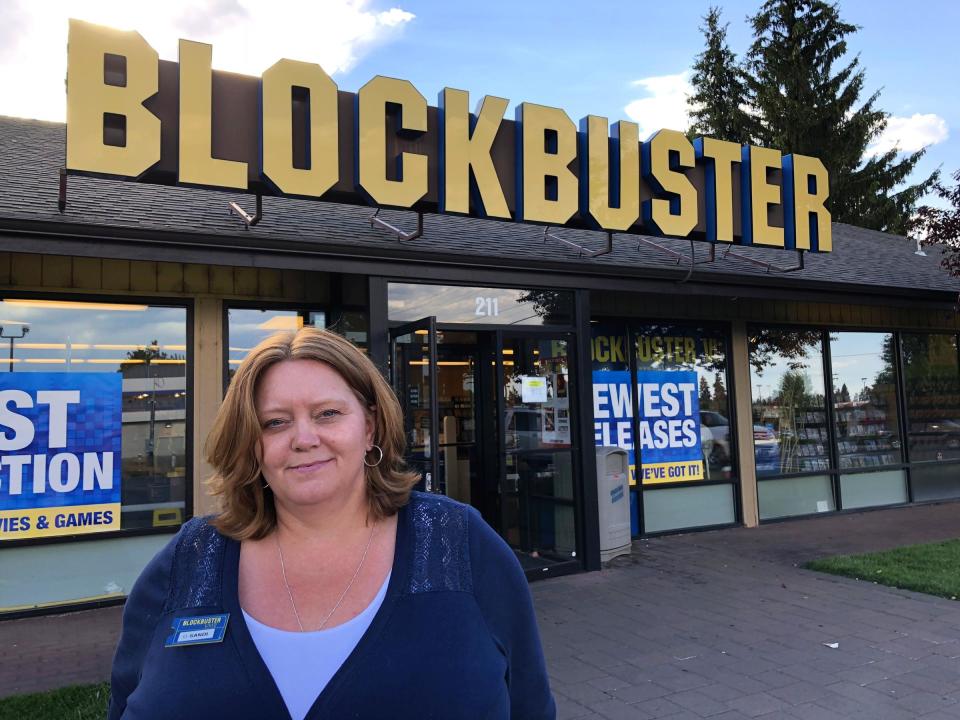 Sandi Harding stands outside America’s only remaining Blockbuster Video in Bend, Oregon. (BRIAN BULL / KLCC)