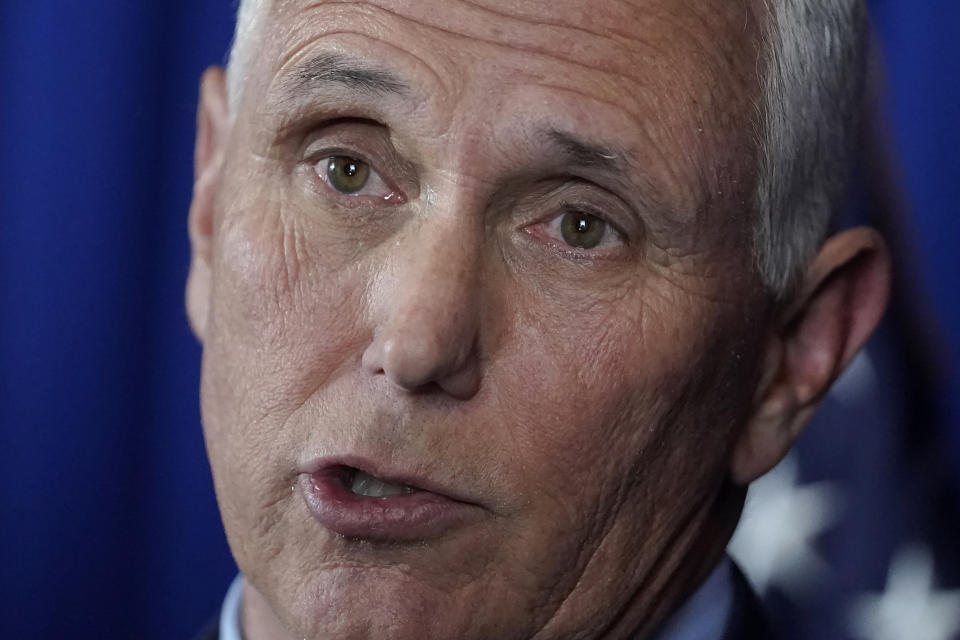 Former Vice President Mike Pence faces reporters after making remarks at a GOP fundraising dinner.