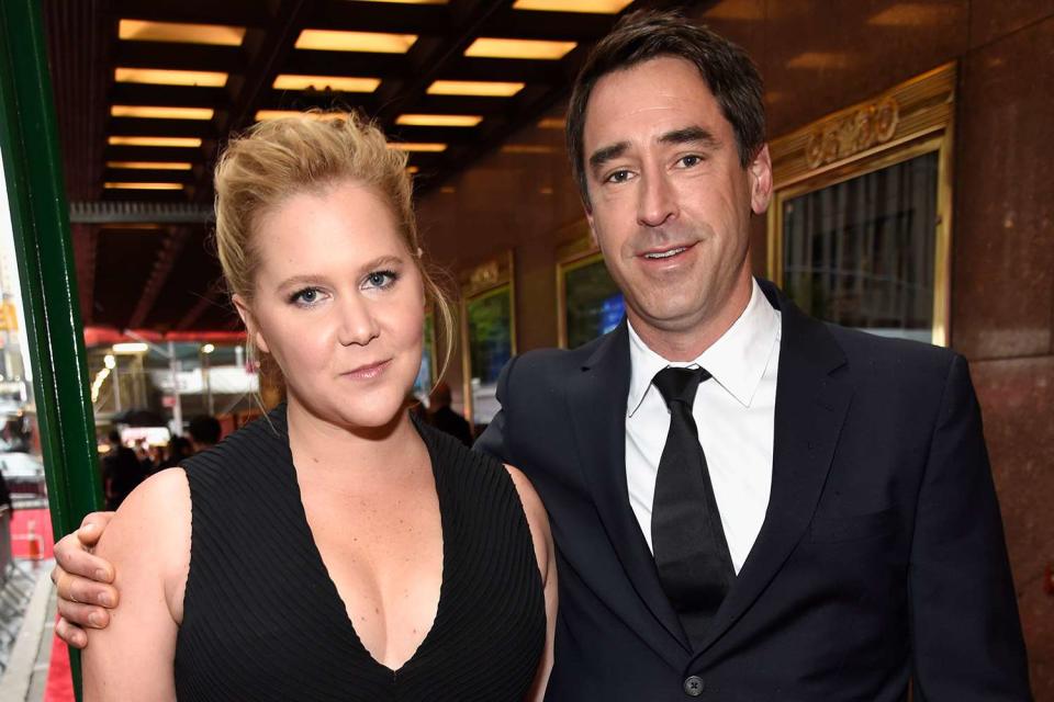 Kevin Mazur/Getty Images  Amy Schumer and Chris Fischer