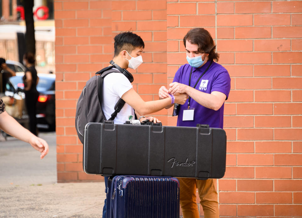 NEW YORK, NEW YORK - AUGUST 18: A student checks in to the NYU dorms in the East Village as the city continues Phase 4 of re-opening following restrictions imposed to slow the spread of coronavirus on August 18, 2020 in New York City. The fourth phase allows outdoor arts and entertainment, sporting events without fans and media production. (Photo by Noam Galai/Getty Images)