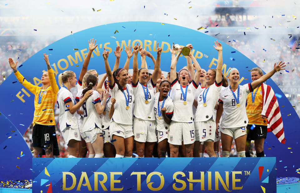 Players from USA lift the FIFA Women's World Cup Trophy following the team's victory over Netherlands. (Naomi Baker/Getty Images)