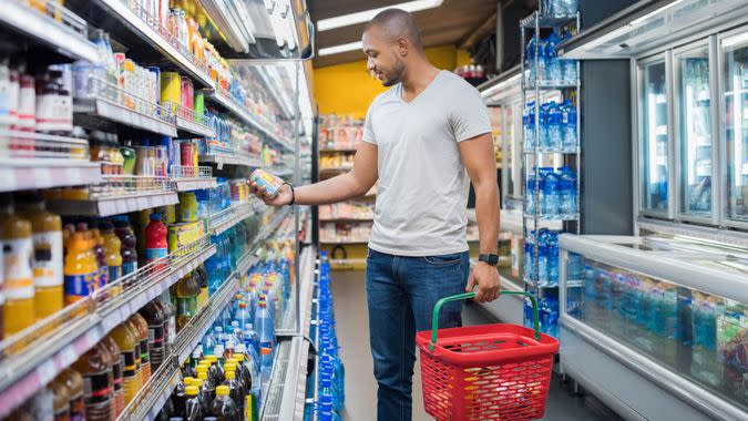 African American man, Price, grocery basket, grocery store