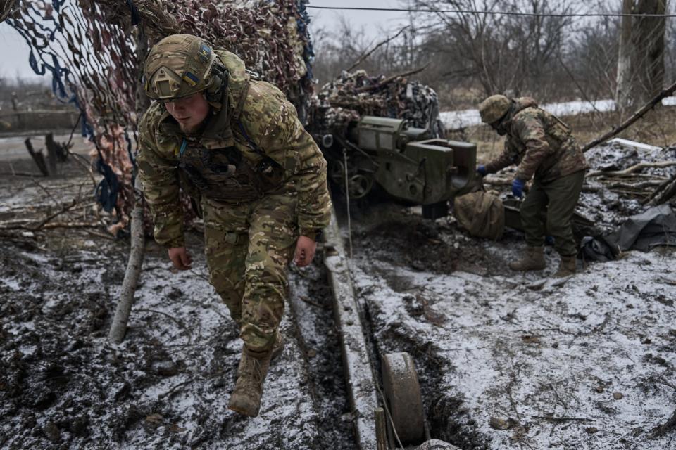 Ukrainian military soldiers fire from the MT-12 or 2A29 gun 'Rapira' is a Soviet smoothbore 100-mm anti-tank gun on 7 December in Avdiivka, Ukraine (Getty Images)