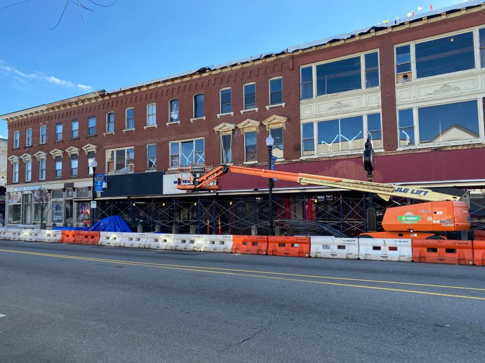 The four buildings comprising the Union Block remain enveloped by construction barriers along Main Street in Taunton on Wednesday, Jan. 3, 2024.