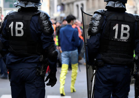 French CRS riot police stand guard in a street during a national day of protest by the "yellow vests" movement in Paris, France, December 8, 2018. REUTERS/Piroschka van de Wouw