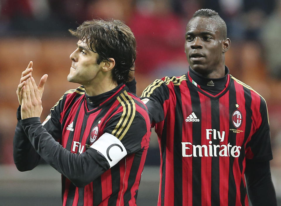 AC Milan Brazilian forward Kaka, left, celebrates with his teammate forward Mario Balotelli after scoring during the Serie A soccer match between AC Milan and Chievo Verona at the San Siro stadium in Milan, Italy, Saturday, March 29, 2014. (AP Photo/Antonio Calanni)