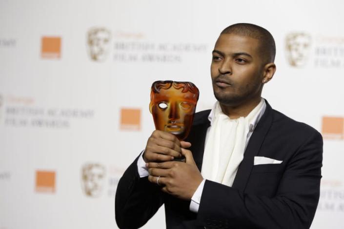 FILE - In this Sunday, Feb. 8, 2009 file photo, British actor and director Noel Clarke, displays his Orange Rising Star Award at the British Academy Film Awards 2009 at The Royal Opera House in London, England. Britain&#39;s motion picture academy on Thursday April 29, 2021, suspended actor-director Noel Clarke after a newspaper reported that multiple women had accused him of sexual harassment or bullying. (AP Photo/Joel Ryan, File)
