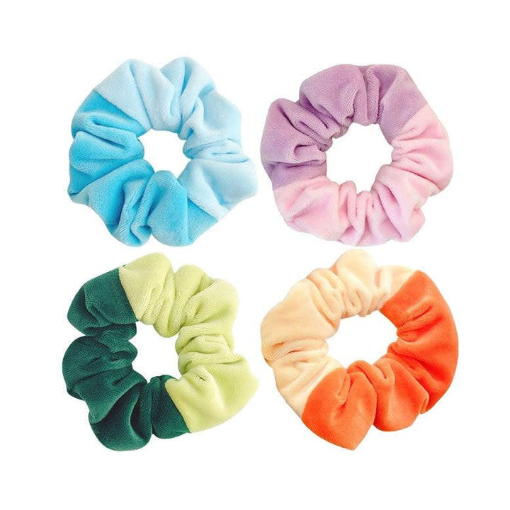 <p><a href="https://kidochicago.com/products/fuzzy-two-tone-scrunchie?_pos=1&_sid=25e8dadc8&_ss=r" rel="nofollow noopener" target="_blank" data-ylk="slk:Shop Now;elm:context_link;itc:0;sec:content-canvas" class="link ">Shop Now</a></p><p>Fuzzy Two Tone Scrunchie</p><p>$5.00</p><p>kidochicago.com</p><span class="copyright">Kido Chicago </span>