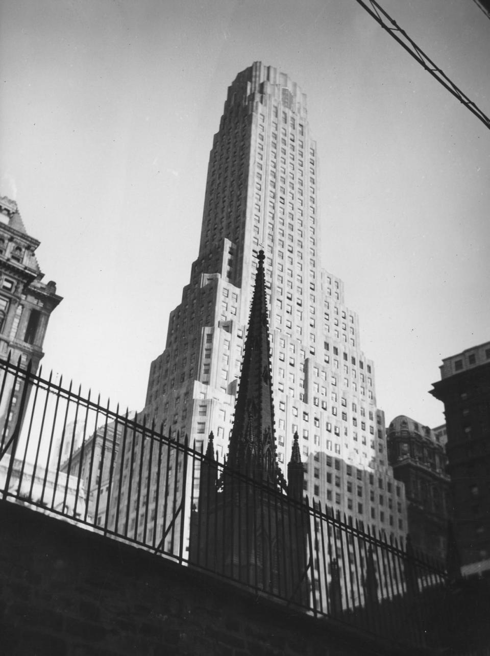 <div class="inline-image__caption"><p>One Wall Street and Trinity Church in 1929.</p></div> <div class="inline-image__credit">Irving Browning/The New York Historical Society/Getty Images</div>