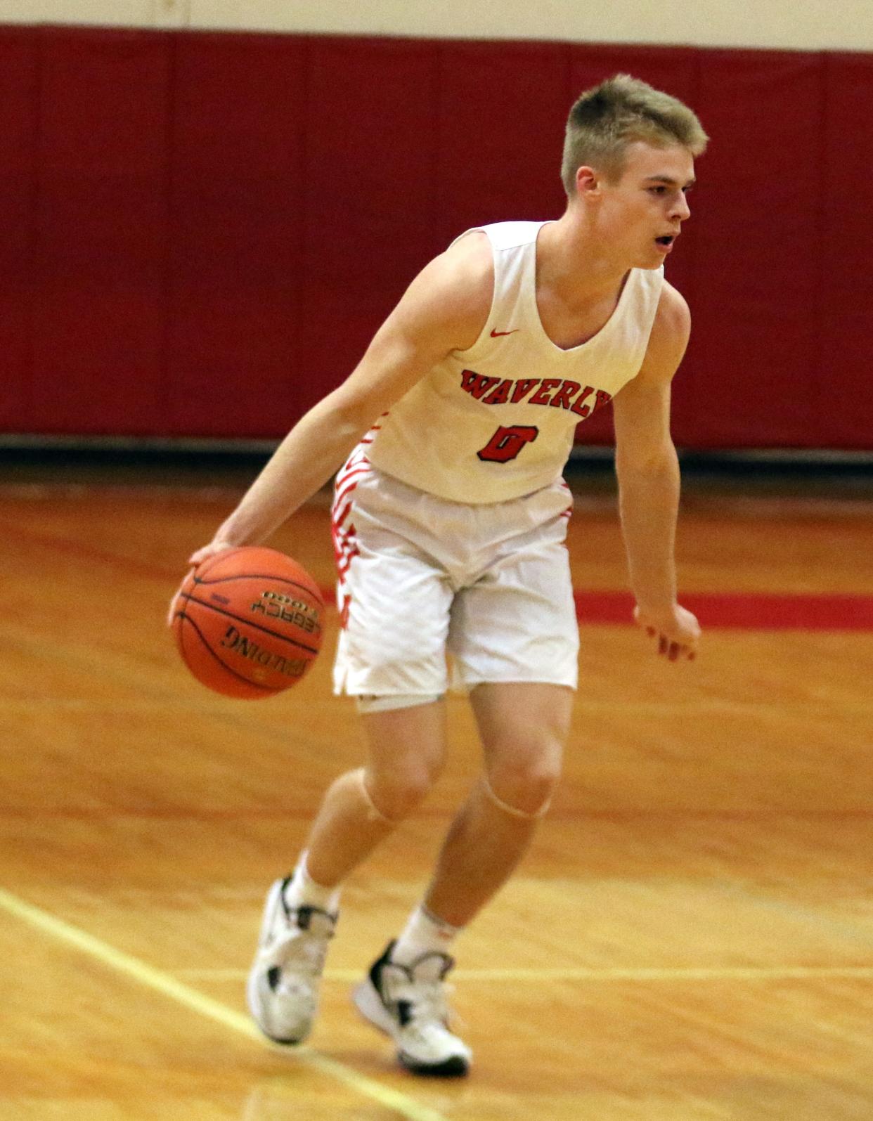 Waverly's Joey Tomasso handles the ball during a 69-53 win over Lansing in a Section 4 Class B boys basketball quarterfinal Feb. 24, 2023 at Waverly High School.