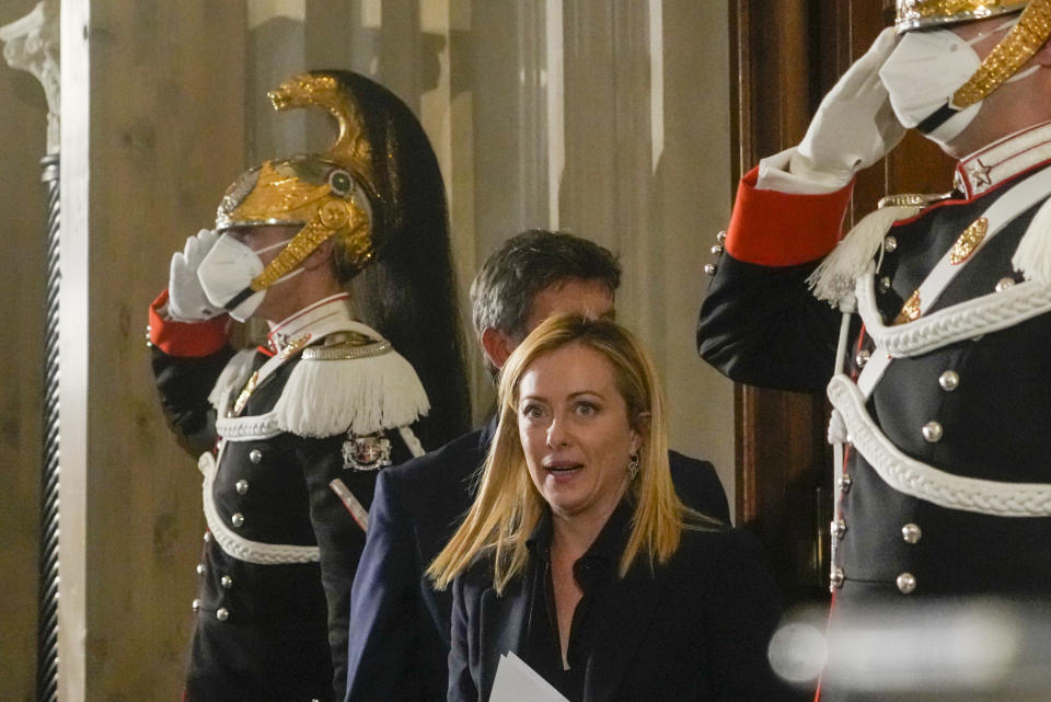 Brothers of Italy's leader Giorgia Meloni arrives to read to the media the list of the ministers of Italy's new government after presenting it to Italian President Sergio Mattarella, at the Quirinale Presidential Palace, in Rome, Friday, Oct. 21, 2022. (AP Photo/Gregorio Borgia)