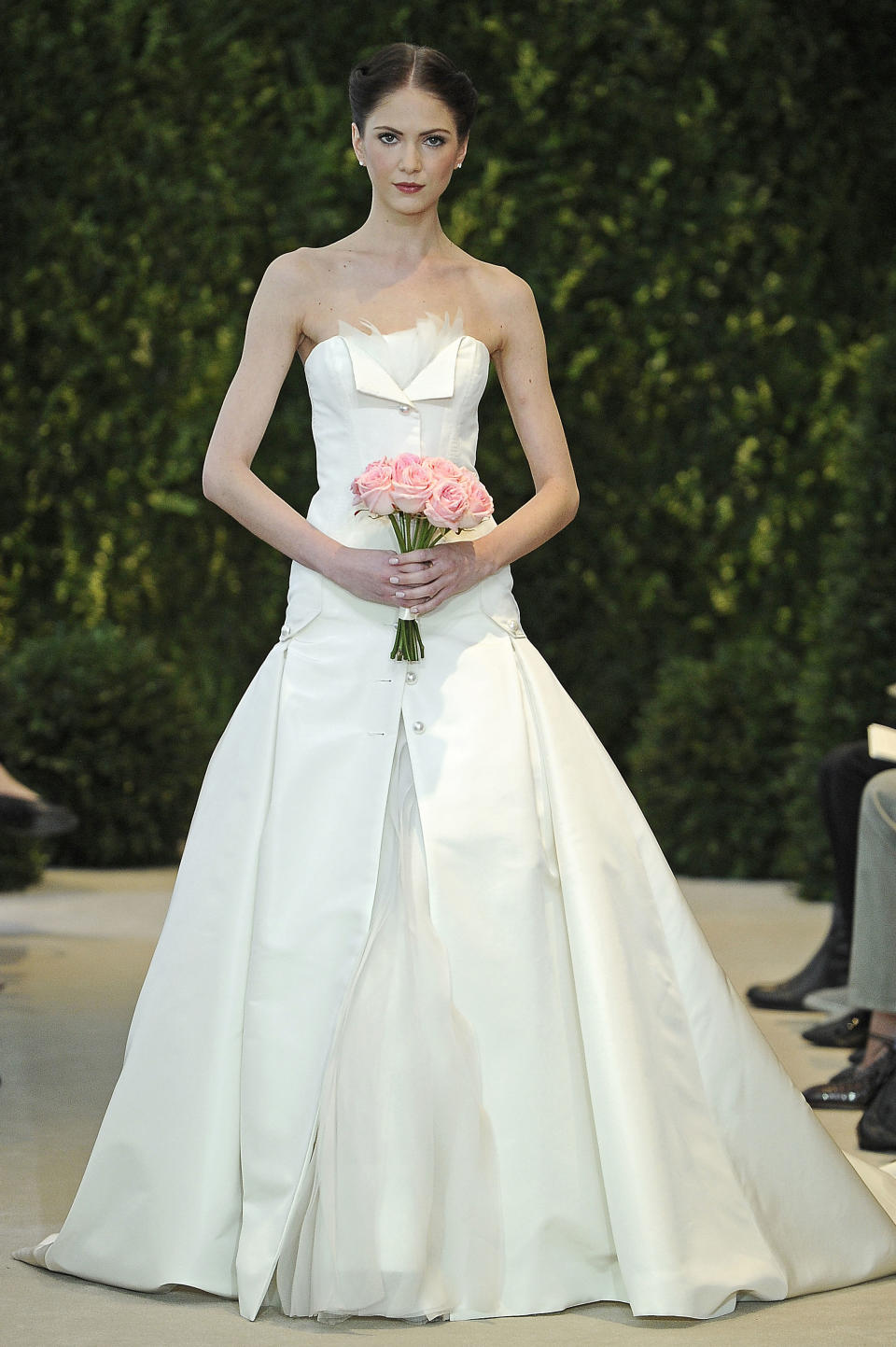 In this photo released by Carolina Herrera Designer, a model presents a bridal fashion creation from the Carolina Herrera collection, in New York, Sunday, April 21, 2013. (AP Photo/Carolina Herrera)