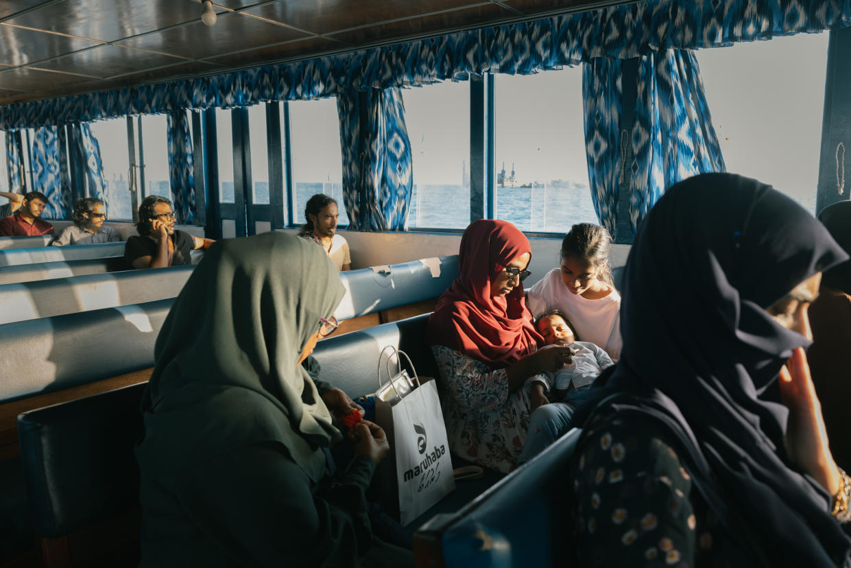 Passengers take the ferry from Malé, the capital of the Maldives, to the nearby island of Villingili on Jan 22, 2024. (Elke Scholiers/The New York Times)