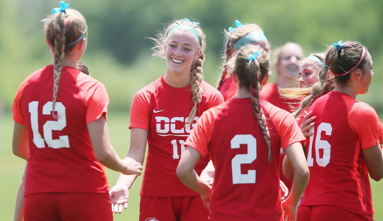 Dallas Center-Grimes' mid-fielder Kylie Knief (11) celebrates with her teammates after a goal from the free-kick during the 2A girls' state quarterfinal at Cownie Soccer Complex on Wednesday, May 31, 2023, in Des Moines.