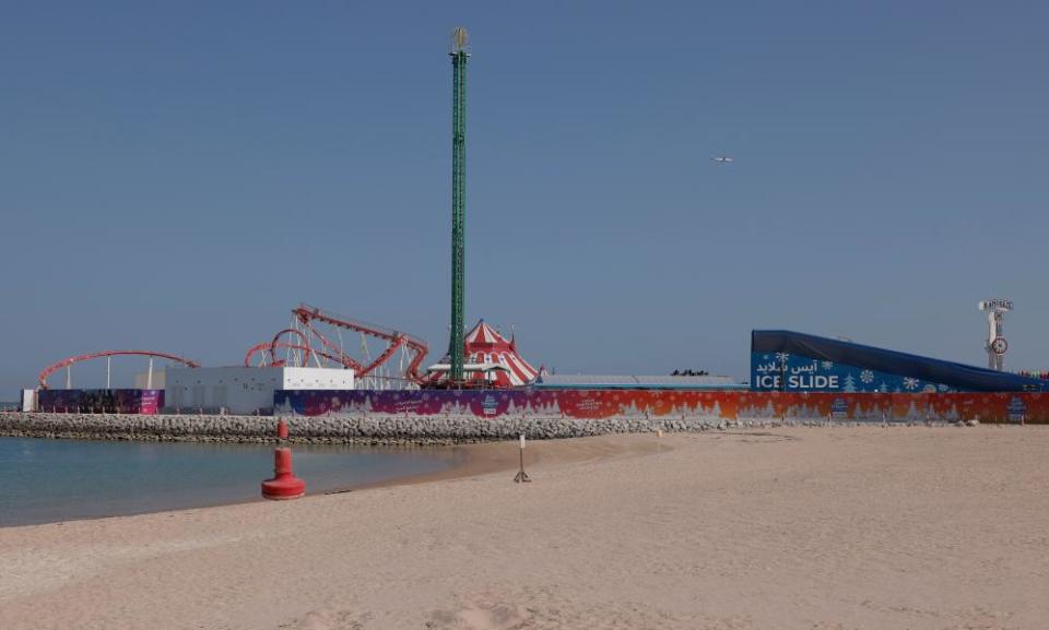 Some of the Winter Wonderland rides are visible including the Ice Slide above the beach on the man-made island of Al Maha.