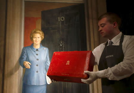 An employee holds The Prime Ministerial Dispatch Box, part of the collection of former British prime minister Margaret Thatcher during an auction preview at Christie's in London, Britain, December 11, 2015. REUTERS/Peter Nicholls