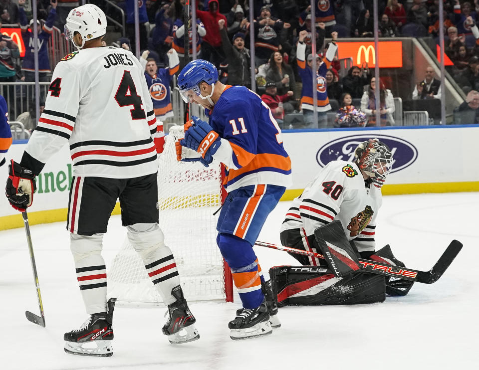 New York Islanders left wing Zach Parise (11) celebrates after scoring against the Chicago Blackhawks during the second period of an NHL hockey game on Sunday, Dec. 4, 2022, in Elmont, N.Y. (AP Photo/Eduardo Munoz Alvarez)