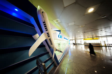 A traveller passes the registration centre, CAE Oxford ATC, where Saudi women can pursue their carrier as a commercial pilots, at King Fahd International Airport in Dammam, Saudi Arabia, July 15, 2018. REUTERS/Hamad I Mohammed