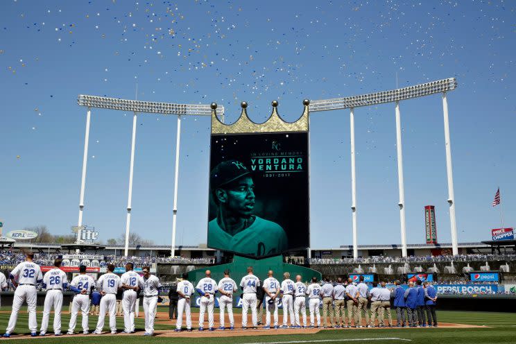 Players observe a moment of silence for deceased pitcher Yordano Ventura prior to the Royals 2017 home opener against the Oakland Athletics. (Getty)