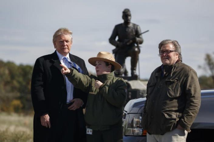 Interpretive park ranger Caitlin Kostic, center, gives a tour near the high-water mark of the Confederacy at Gettysburg National Military Park to Republican presidential candidate Donald Trump, left, and campaign CEO Steve Bannon, Saturday, Oct. 22, 2016, in Gettysburg, Pa. (Photo: Evan Vucci/AP)