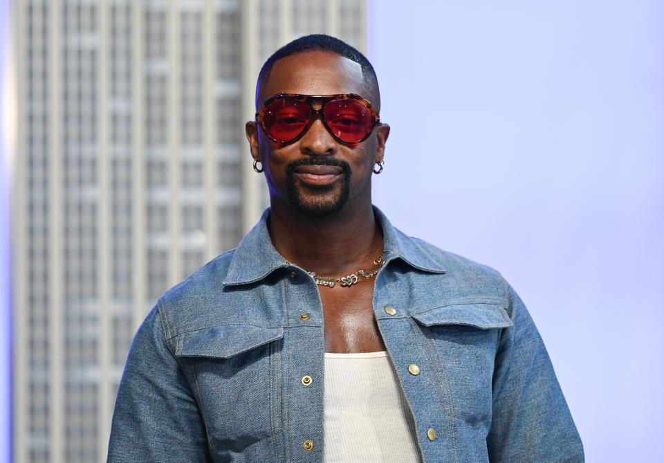 Fashion designer LaQuan Smith participates in a New York Fashion Week kickoff event at the Empire State Building on Thursday, Sept. 9, 2021, in New York. (Photo by Evan Agostini/Invision/AP)