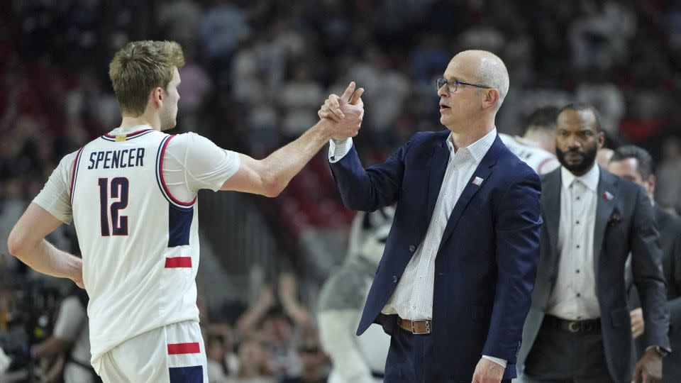 Hurley high fives guard Cam Spencer. - Bob Donnan/USA TODAY Sports/Reuters