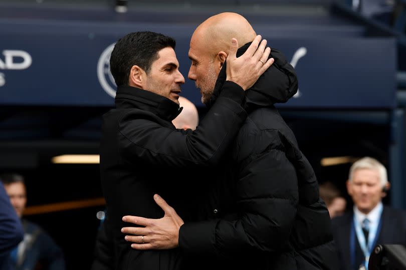 Mikel Arteta, Manager of Arsenal, interacts with Pep Guardiola, Manager of Manchester City, prior to the Premier League match between Manchester City and Arsenal FC at Etihad Stadium on March 31, 2024 in Manchester, England.