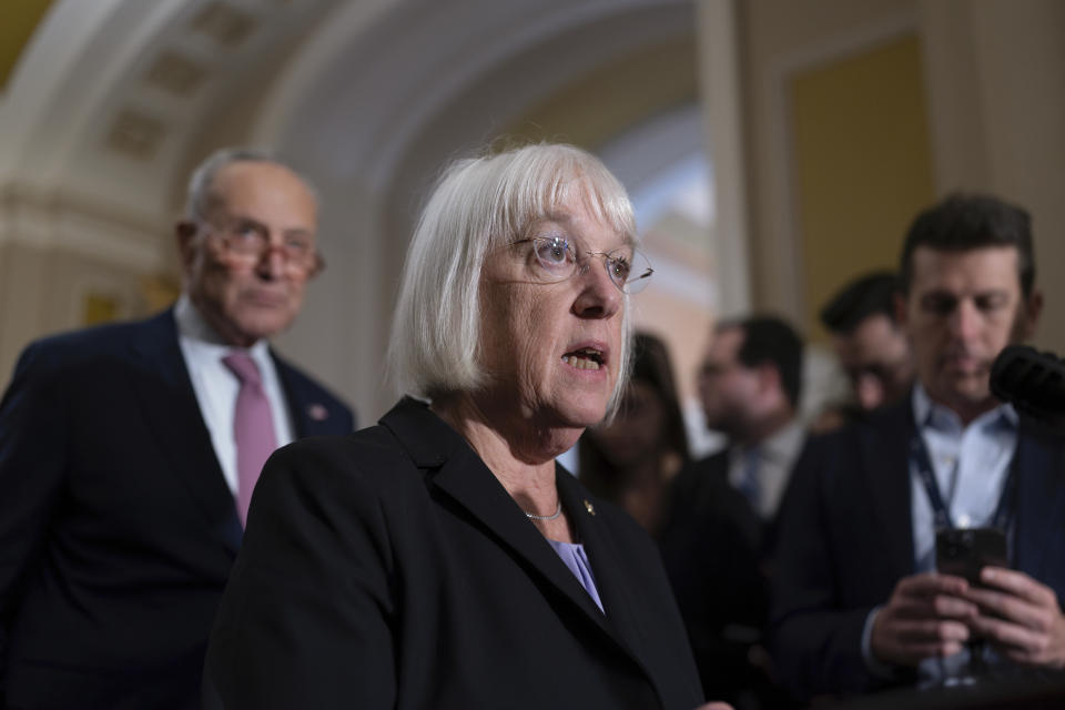 Senate Appropriations Committee Chair Patty Murray, D-Wash., joined at rear by Senate Majority Leader Chuck Schumer, D-N.Y., left, speaks to reporters following a closed-door caucus meeting, at the Capitol in Washington, Wednesday, Sept. 27, 2023. (AP Photo/J. Scott Applewhite)