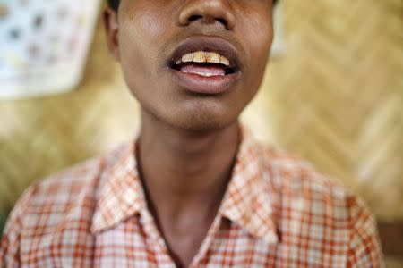 A victim of forced labour speaks during a Reuters interview in a village at Buthidaung township in northern Rakhine state June 10, 2015. REUTERS/Soe Zeya Tun