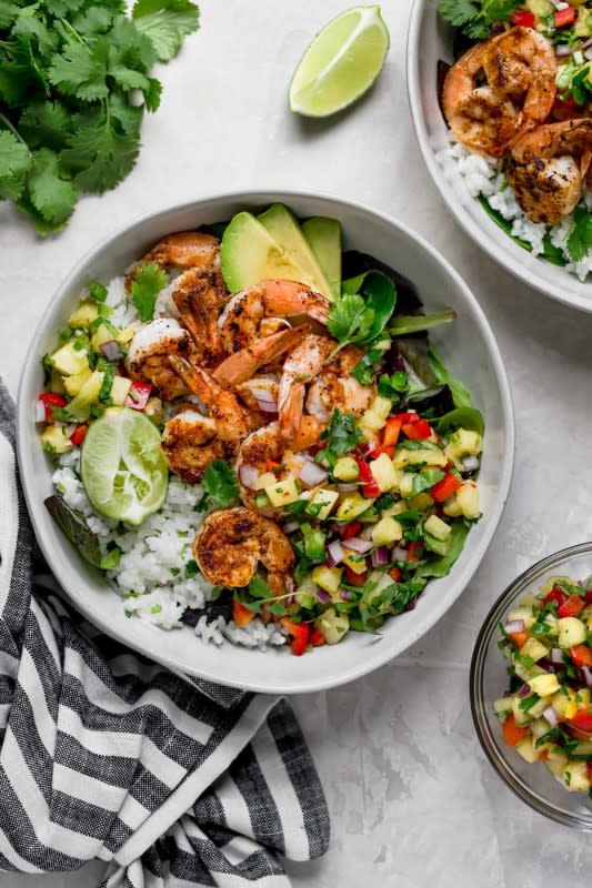 <p>Two Peas and Their Pod</p><p>Shrimp bowls with coconut cilantro lime rice and pineapple salsa are ready in just 30 minutes.</p><p><strong>Get the recipe: <a href="https://www.twopeasandtheirpod.com/shrimp-bowls-with-coconut-cilantro-lime-rice-pineapple-salsa/" rel="nofollow noopener" target="_blank" data-ylk="slk:Shrimp Bowls with Coconut Cilantro Lime Rice and Pineapple Salsa;elm:context_link;itc:0;sec:content-canvas" class="link rapid-noclick-resp">Shrimp Bowls with Coconut Cilantro Lime Rice and Pineapple Salsa</a></strong></p>