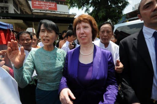 Myanmar's pro-democracy leader Aung San Suu Kyi (left) walks with EU foreign policy chief Catherine Ashton in Yangon. Ashton urged Myanmar to make its progress towards democracy "irreversible" and called for an end to bloody ethnic conflict