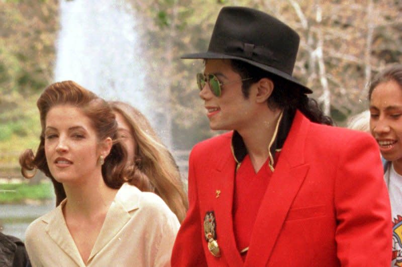 Michael Jackson (R) is pictured in April 1995 with Lisa Marie Presley in Los Angeles. On August 1, 1994, Presley confirmed rumors that she had married the pop star May 26 in the Dominican Republic. The couple divorced less than two years later. File Photo by Jim Ruymen/UPI