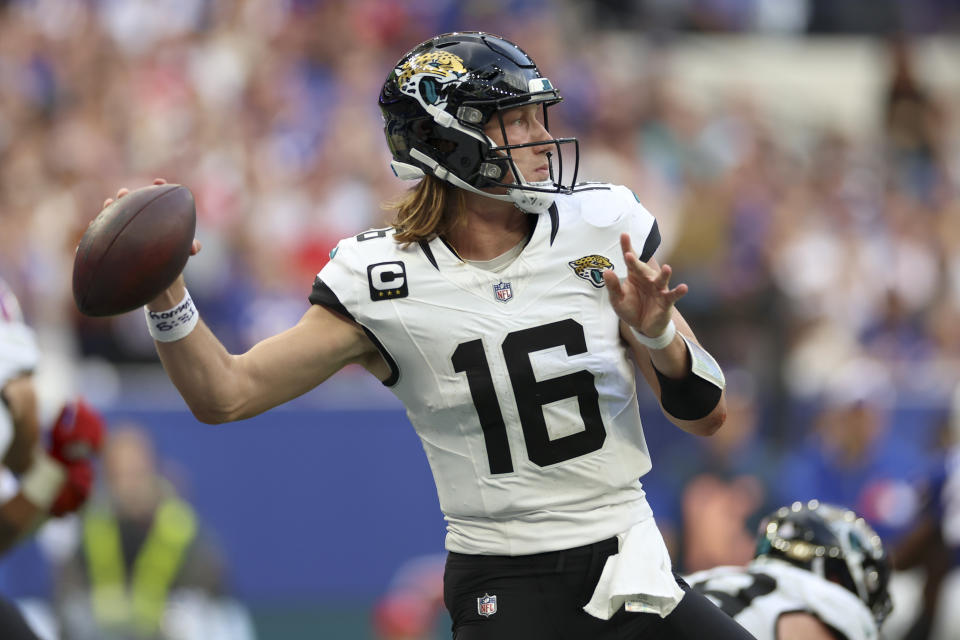 Jacksonville Jaguars quarterback Trevor Lawrence (16) passes the ball during an NFL football game between Jacksonville Jaguars and Buffalo Bills at the Tottenham Hotspur stadium in London, Sunday, Oct. 8, 2023. (AP Photo/Ian Walton)