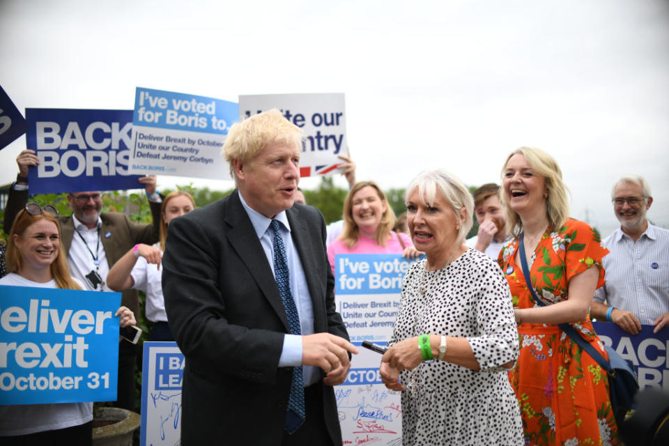 Conservative Party leadership candidate Boris Johnson with Nadine Dorries (centre) and Chief Secretary to the Treasury Liz Truss (right) during a Tory leadership hustings at the Woodlands Event Centre in Wyboston, Bedfordshire. Source: Joe Giddens/PA Images via Getty Images