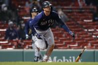 Seattle Mariners' Mitch Haniger watches his three-run home run during the 10th inning of a baseball game against the Boston Red Sox, Thursday, April 22, 2021, in Boston. (AP Photo/Michael Dwyer)