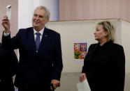 Czech President Milos Zeman and his wife Ivana are seen as they cast their votes during the country's direct presidential election at a polling station in Prague, the Czech Republic January 12, 2018. REUTERS/David W Cerny