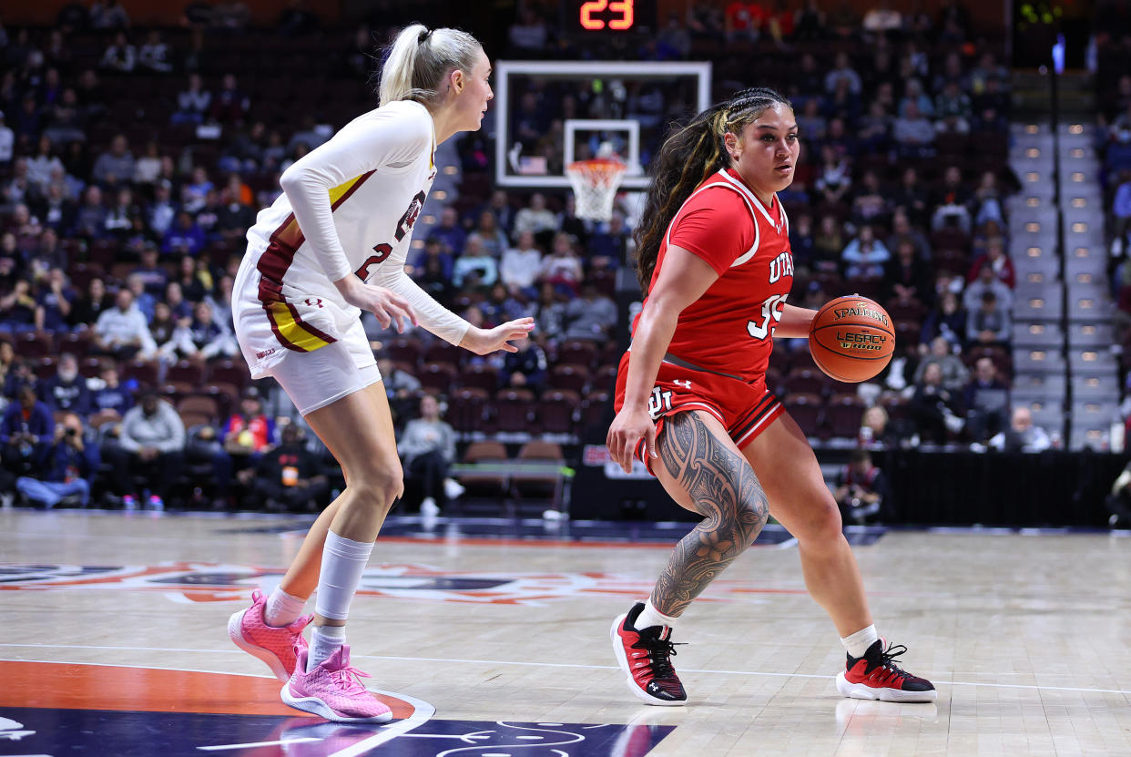 UNCASVILLE, CT - DECEMBER 10: Utah Utes forward Alissa Pili (35) is defended by South Carolina Gamecocks forward Chloe Kitts (21) during the Basketball Hall of Fame Women's Showcase game between South Carolina Gamecocks and Utah Utes on December 10, 2023, at Mohegan Sun Arena in Uncasville, CT. (Photo by M. Anthony Nesmith/Icon Sportswire via Getty Images)
