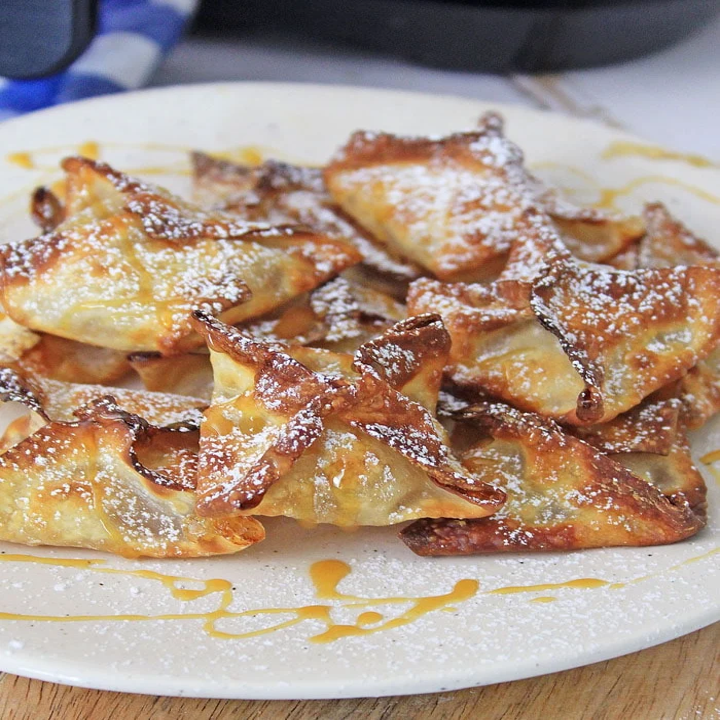 Apple pie wontons with caramel drizzle.