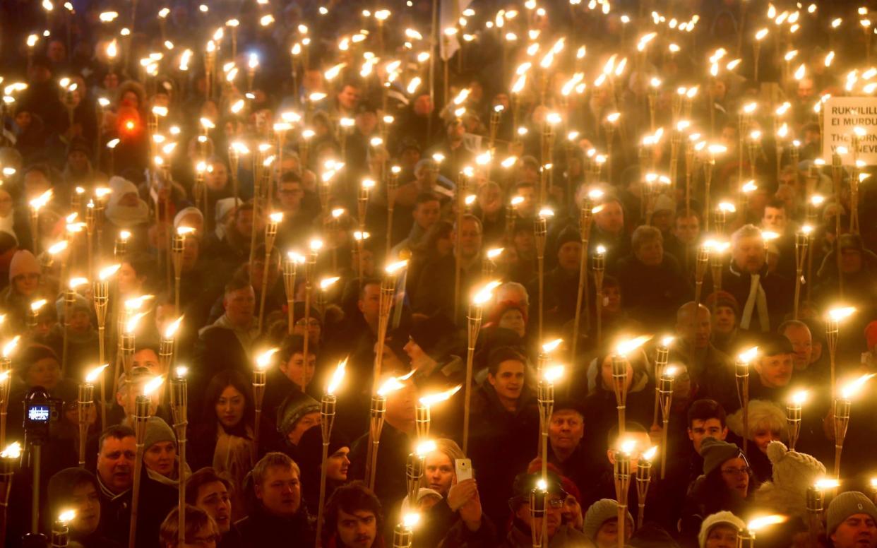 A torch-lit march part-organised by the far-Right EKRE party in Tallinn last week - REUTERS