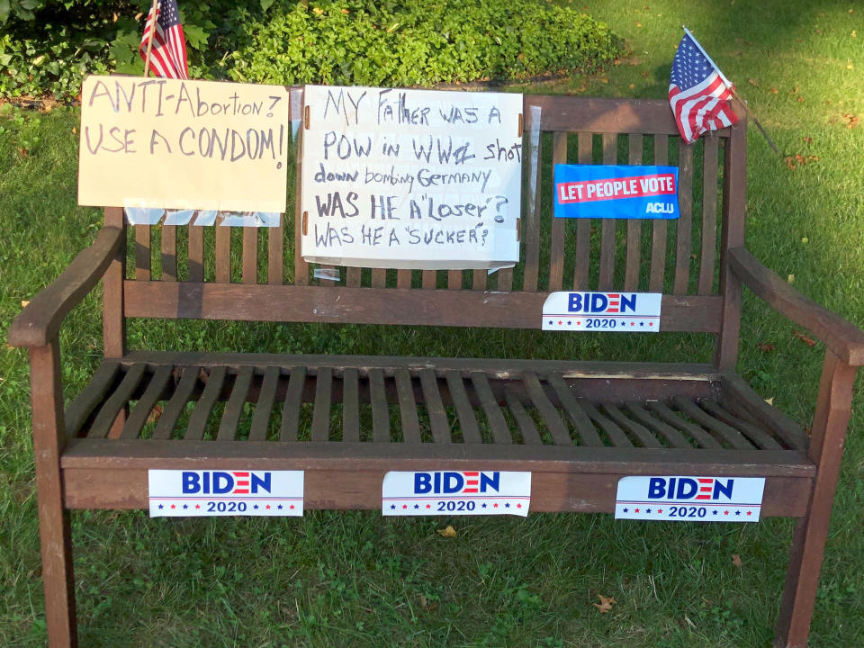 Janice Wolk, 74, transformed this bench turned into a pro-Biden and anti-Trump campaign sign at her home in suburban Pittsburgh. (Allan Smith / NBC News)