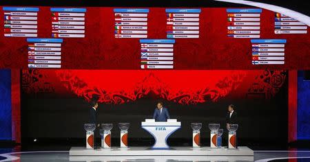 Former German soccer player Oliver Bierhoff, FIFA Secretary General Jerome Valcke and Former Russian soccer player Aleksandr Kerzhakov (L-R) present the overview of the European zone draw during the preliminary draw for the 2018 FIFA World Cup at Konstantin Palace in St. Petersburg, Russia July 25, 2015. REUTERS/Stringer