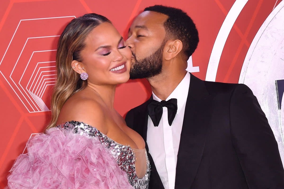 John Legend and his wife model Chrissy Teigen attend the 74th Annual Tony Awards at the Winter Garden Theater in New York (AFP via Getty Images)