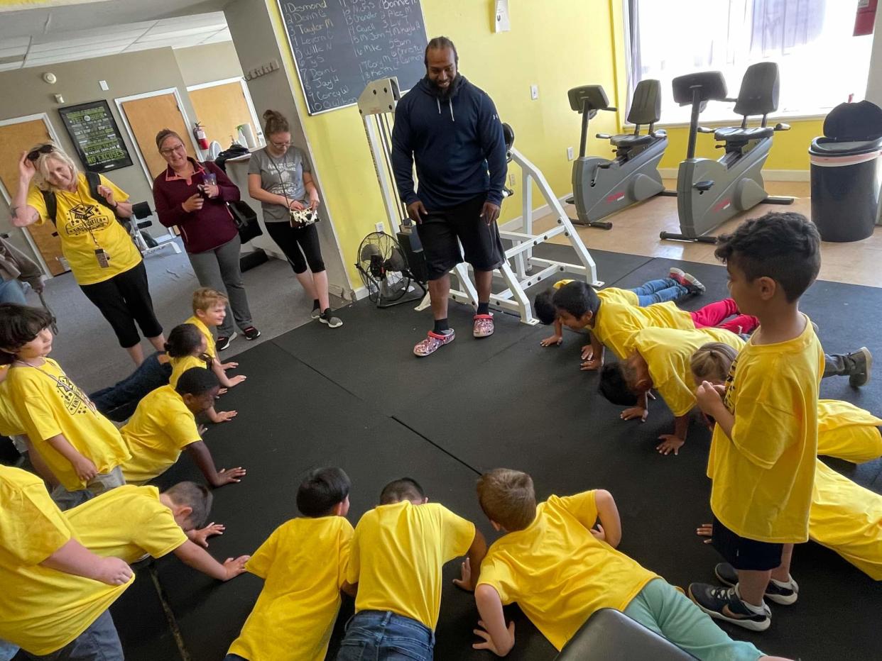 Desmond Jordan, owner of The House of Gains, instructs students during a physical education class.