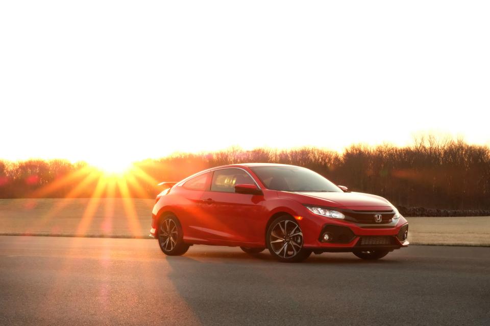 <p>Easily the best-handling front-wheel-drive car on the market today, <a rel="nofollow noopener" href="https://www.caranddriver.com/honda/civic-si" target="_blank" data-ylk="slk:Honda's Civic Si coupe;elm:context_link;itc:0;sec:content-canvas" class="link ">Honda's Civic Si coupe </a>(and its mechanically identical four-door sedan sibling) is a performance bargain. It is quick, thanks to its turbocharged four-cylinder engine, and it is fun to drive, thanks to its six-speed manual transmission and well-sorted chassis. The Si model exists between the mainstream Civic lineup and <a rel="nofollow noopener" href="https://www.caranddriver.com/honda/civic-type-r" target="_blank" data-ylk="slk:the bonkers, 306-hp Civic Type R;elm:context_link;itc:0;sec:content-canvas" class="link ">the bonkers, 306-hp Civic Type R</a>, and shares <a rel="nofollow noopener" href="https://www.caranddriver.com/features/a25252134/10best-cars-2019/" target="_blank" data-ylk="slk:a 10Best Cars award from us;elm:context_link;itc:0;sec:content-canvas" class="link ">a 10Best Cars award from us</a> with the latter. We've also run the Si at our <a rel="nofollow noopener" href="http://www.caranddriver.com/features/honda-civic-si-at-lightning-lap-2017-feature" target="_blank" data-ylk="slk:annual Lightning Lap track test;elm:context_link;itc:0;sec:content-canvas" class="link ">annual Lightning Lap track test</a> in 2017, where it was the only car that year to gain speed through Virginia International Raceway's treacherous high-speed uphill ess-curves. To see what sets it apart from the regular Civic, swipe on!</p>