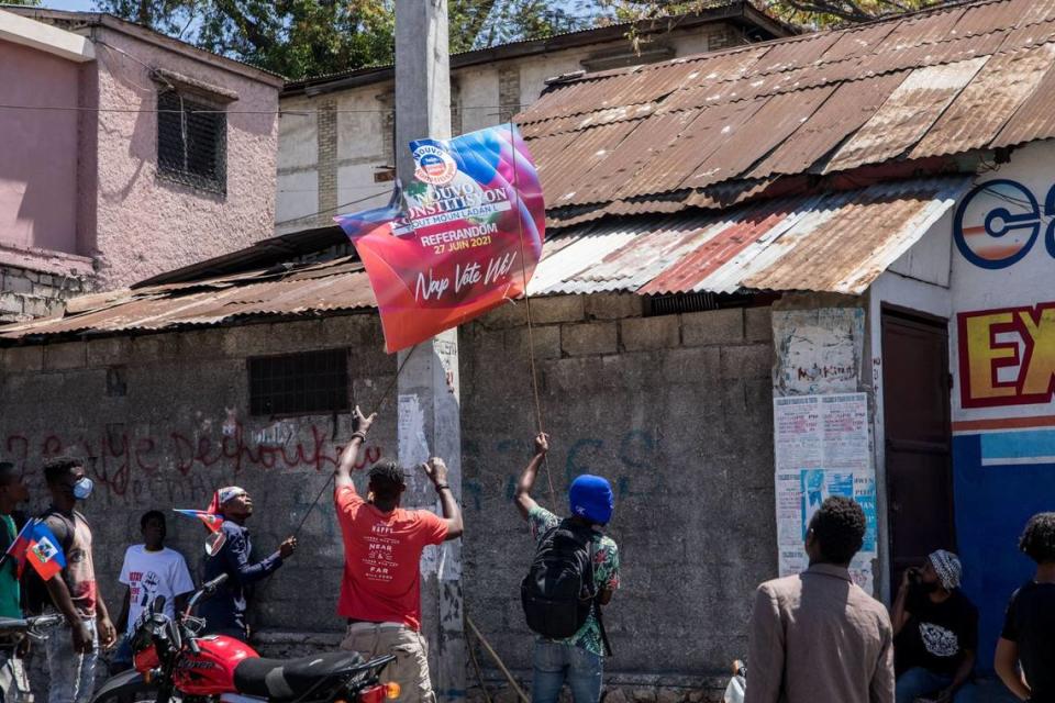 Haitians demonstrate during a protest to denounce the draft constitutional referendum carried by the President Jovenel Moise on March 28, 2021 in Port-au-Prince.